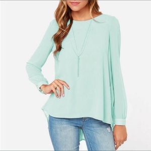 Long sleeve flowy shirt with a cute longer back.